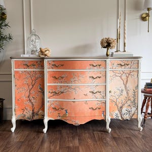 Customer photo — chinoiserie mural behind a painted dresser